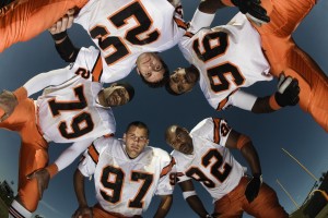 Football Team in a Huddle