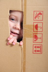 Child looking from box