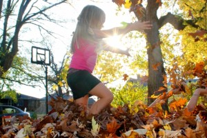 jumping in fall leaves